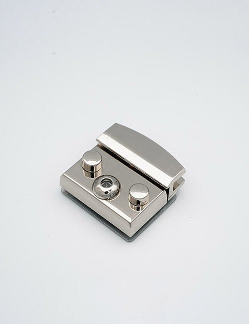 A metallic rectangular YIPAI Closures clamp with two round knobs and a central screw is shown on a plain white background.