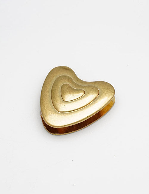 The YIPAI Closures is a gold heart-shaped metal piece featuring three layered hearts in descending sizes, displayed on a plain white background.
