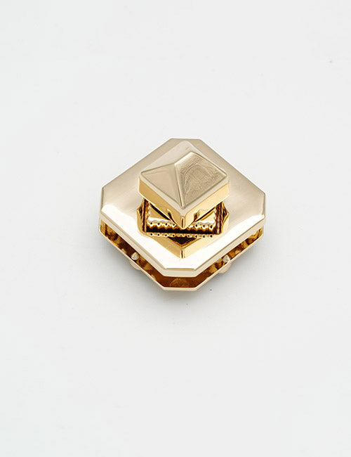 The YIPAI Closures is a gold hexagonal clasp with a shiny metallic finish, raised pyramid-shaped center, and detailed edges, shown on a plain white background.