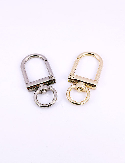 Two YIPAI Snap Hooks, one in silver and one in gold, are displayed side by side on a plain white background. Each hook features a rectangular loop and a circular base ring.