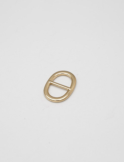 A small, gold, oval-shaped metal buckle with a central bar from YIPAI Buckles is displayed on a plain white background.