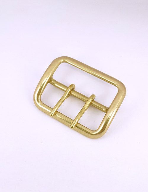 A YIPAI Buckles gold-colored metal belt buckle with two prongs, shown on a plain white background.