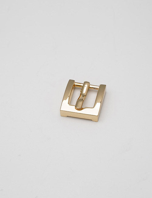 A small, shiny gold square belt buckle from YIPAI’s Buckles line with a single prong is displayed on a plain, light gray background.