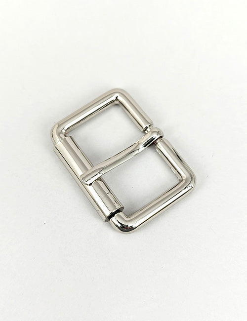 A shiny, silver, rectangular YIPAI Buckles metal belt buckle with rounded edges displayed on a plain white background.