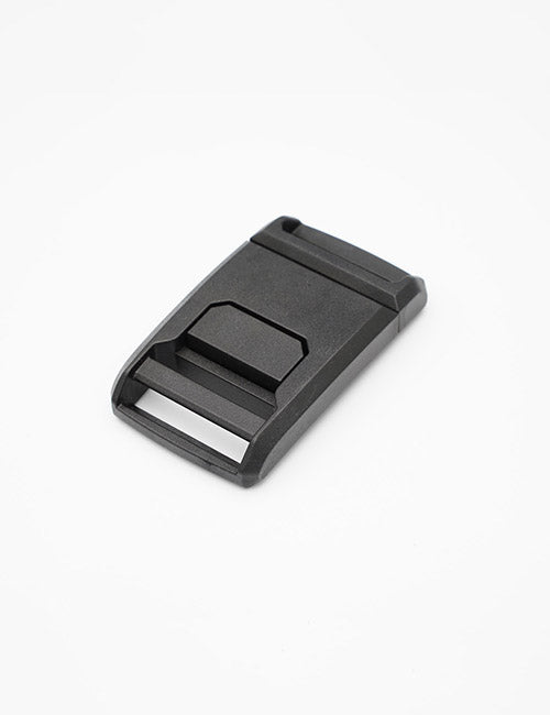 A YIPAI black plastic buckle with a rectangular shape, angled edge, and strap slot is displayed on a plain white background.