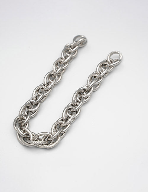 The YIPAI Chains features thick silver interlocking links, displayed in a gentle curve on a plain white background.