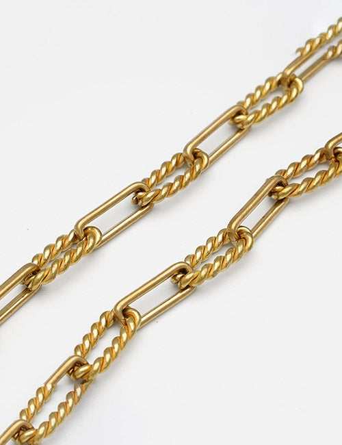 Two YIPAI Chains featuring alternating twisted and oval links are displayed diagonally on a white background.