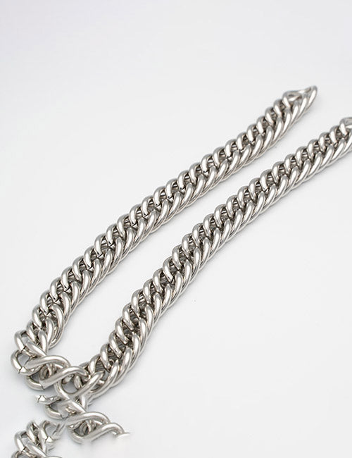 A close-up of YIPAI Chains, featuring thick, interlocking silver links with a shiny, polished finish, displayed on a plain white surface.