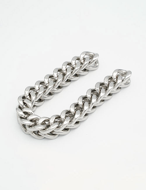 The YIPAI Chains bracelet features thick, silver, interlocking links, arranged in a curved shape against a plain white background.