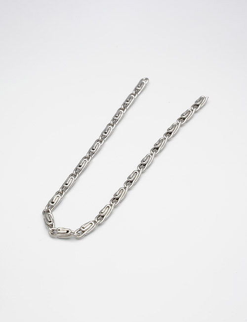 The YIPAI Chains silver necklace with oval-shaped links is displayed in an open curve on a plain white background.