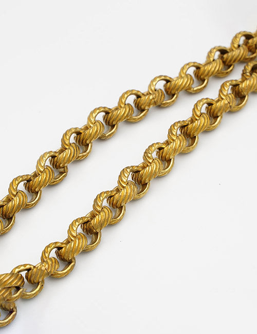 YIPAI Chains: Two intertwined gold chains with textured, round links displayed on a plain white background.