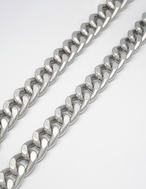 Two thick silver metal Chains by YIPAI, featuring interlocking links, are laid parallel on a plain white background.