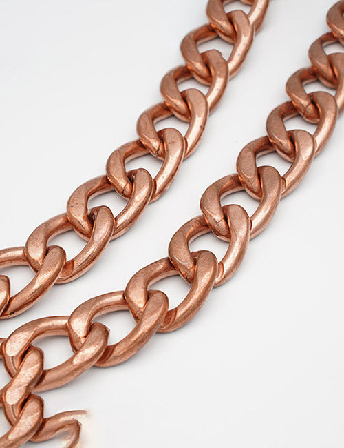 Close-up of two YIPAI Chains, featuring copper-colored large oval links, displayed against a plain white background.