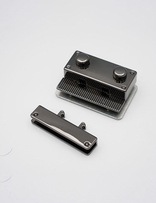 The YIPAI Closures metallic rectangular purse clasp frame features two round knobs and comes with a matching flat rectangular attachment, both displayed on a plain white background.