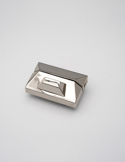 The YIPAI Closures feature a geometric, metallic design with a shiny, reflective surface and angular, faceted sides, displayed on a plain light gray background.