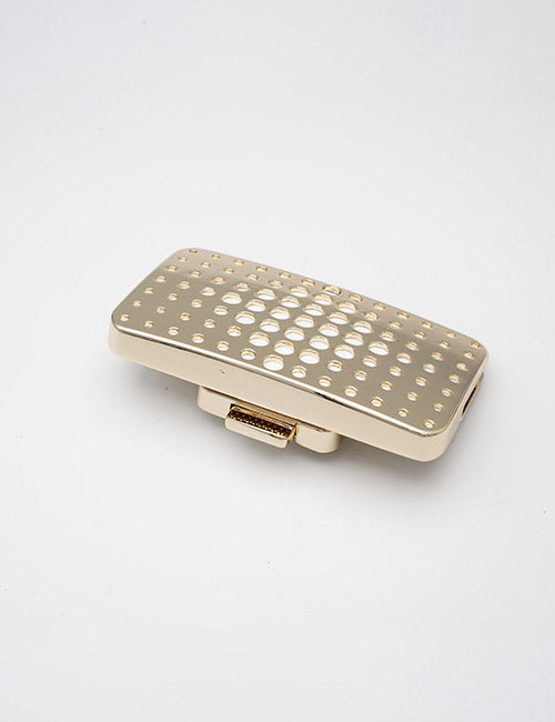 A gold, rectangular YIPAI Closures guitar pickup with a grid of circular holes on top, shown against a plain white background.