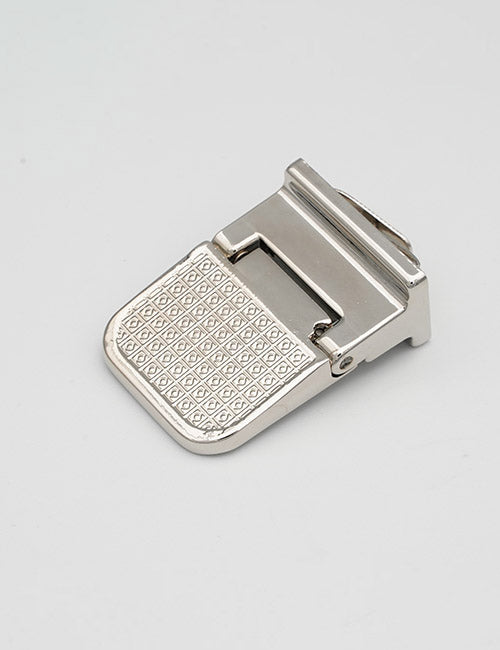 A close-up of a YIPAI Closures metal belt buckle featuring a textured, square-patterned surface against a plain white background.