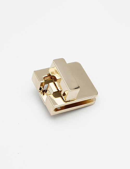 The YIPAI Closures is a gold metal paper clip featuring a rectangular, geometric design, shown on a white background.