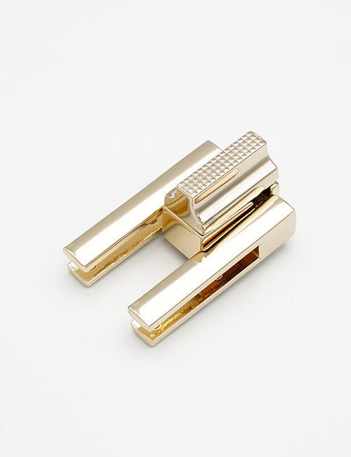 A gold-colored YIPAI Closures stapler with a modern, minimalist design is displayed on a plain white background.