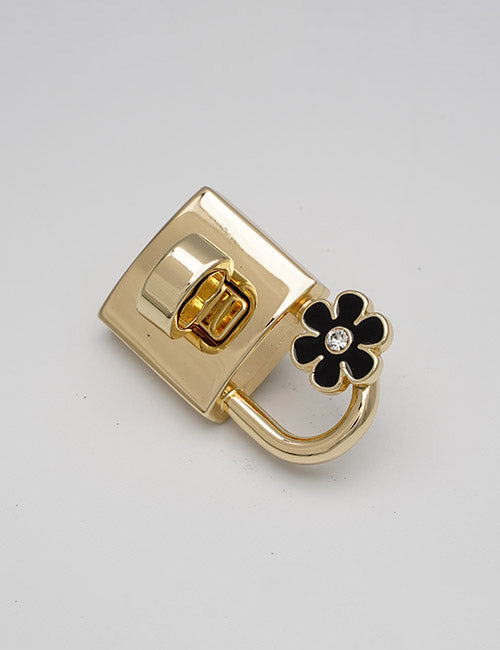 The YIPAI Closures gold padlock features a black flower charm with a central rhinestone, shown on a plain white background.