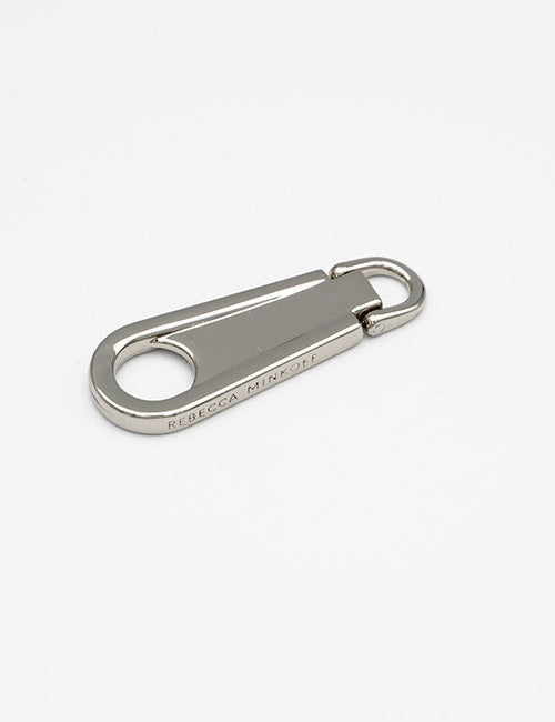 A silver metal keychain with a modern design and rounded edges, engraved with YIPAI Fasteners on the side, placed on a plain white background.