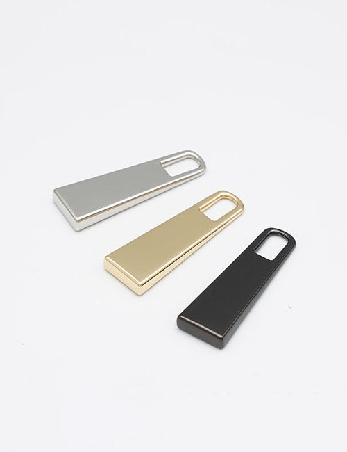 Three sleek, rectangular YIPAI Fasteners in silver, gold, and black are arranged diagonally on a plain white background. Each features a minimalist design with a cutout at one end.