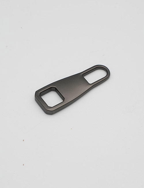 The YIPAI Fasteners is a matte black metal bottle opener featuring a rectangular hole on one end and an oval hole on the other, shown against a plain white background.