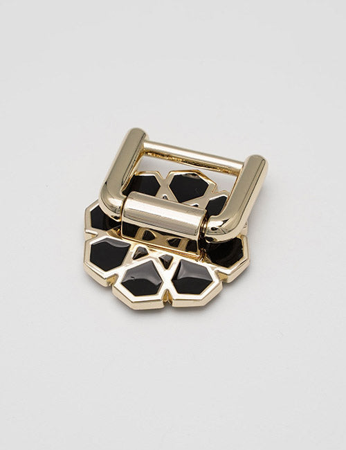The YIPAI Handles feature a gold metal buckle with a geometric flower design and black enamel accents, shown on a plain light gray background.
