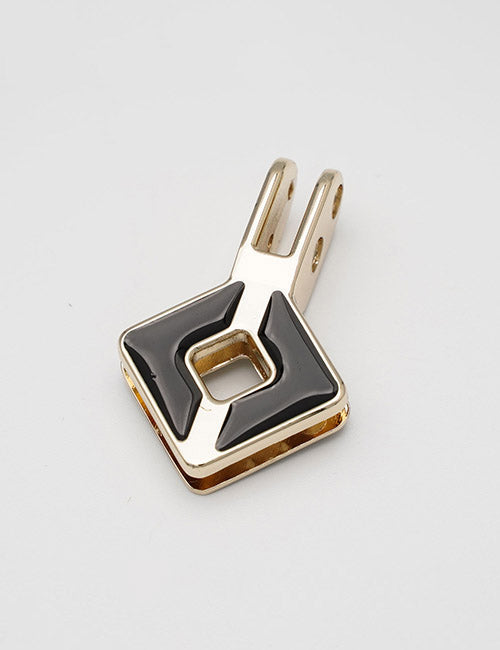 The YIPAI Handles are gold and black geometric metal pendants with a square shape, a hollow center, two black triangular enamel accents, and a double-loop attachment at the top.
