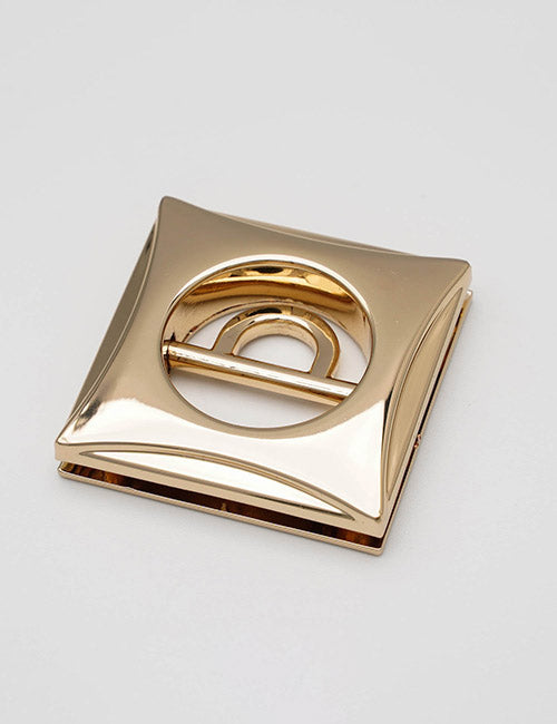 A shiny, square gold YIPAI Handles buckle with a circular cutout in the center, displayed on a plain light gray background.