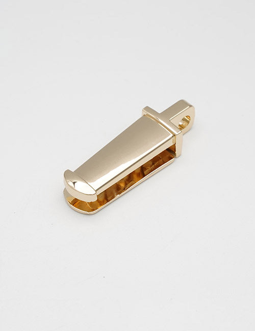 The YIPAI Handles pendant features a gold-colored metal design in the shape of a stylized razor blade, displayed on a plain white surface.