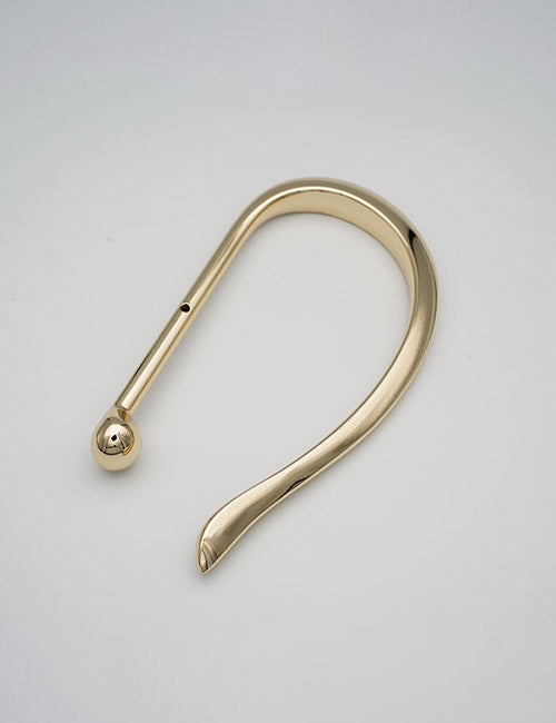 A YIPAI Handles product, featuring a curved gold-colored metal design with a rounded end and tapered point, shown against a plain light gray background.