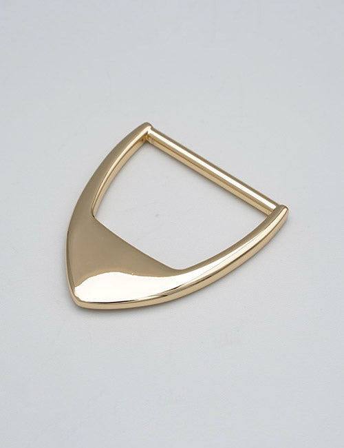 A shiny gold triangular metal handle by YIPAI with rounded edges and a smooth surface lies flat on a light gray background.