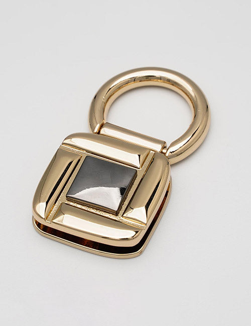 A gold, square-shaped YIPAI Handles accessory featuring a black reflective center inset, displayed on a plain white background.