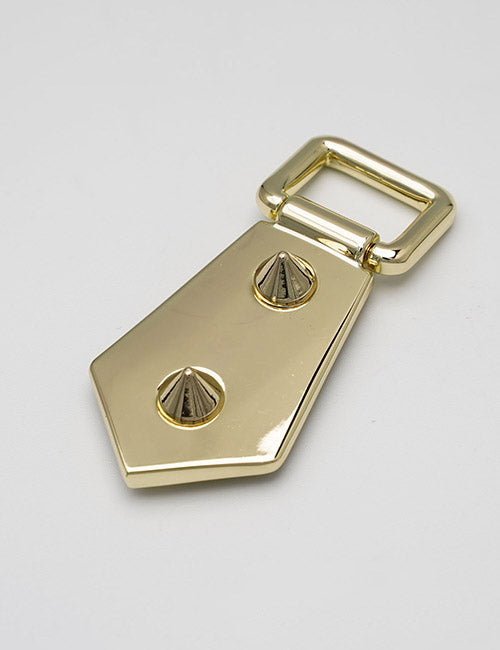 A gold-colored metal belt buckle from YIPAI Handles features a geometric pointed end and two decorative screw-like studs, displayed against a plain white background.