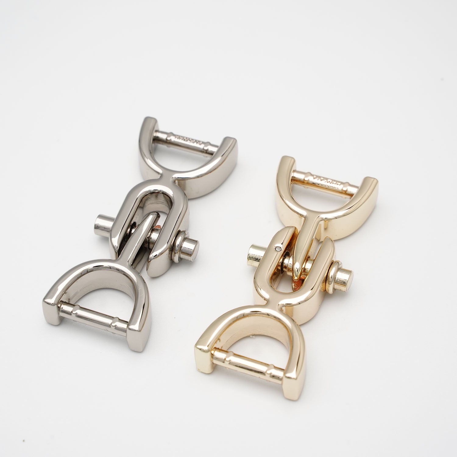 Two YIPAI Handles, one silver and one gold, are displayed side by side on a white background. Each handle features a D-shaped loop and a cylindrical hinge.