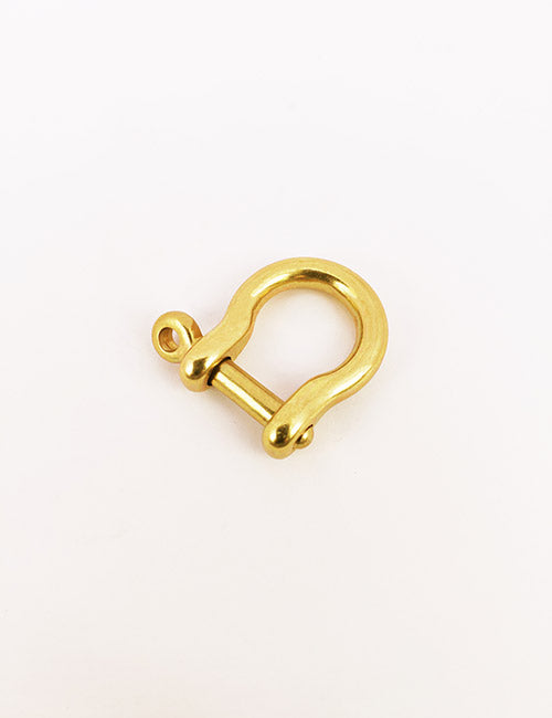 A YIPAI Handles gold-colored metal D-shackle, featuring a curved body and removable pin, displayed on a plain white background.