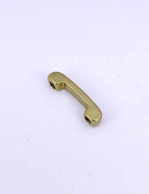 The YIPAI Handles is a small, curved brass metal handle with two screw holes at each end, shown on a plain white background.