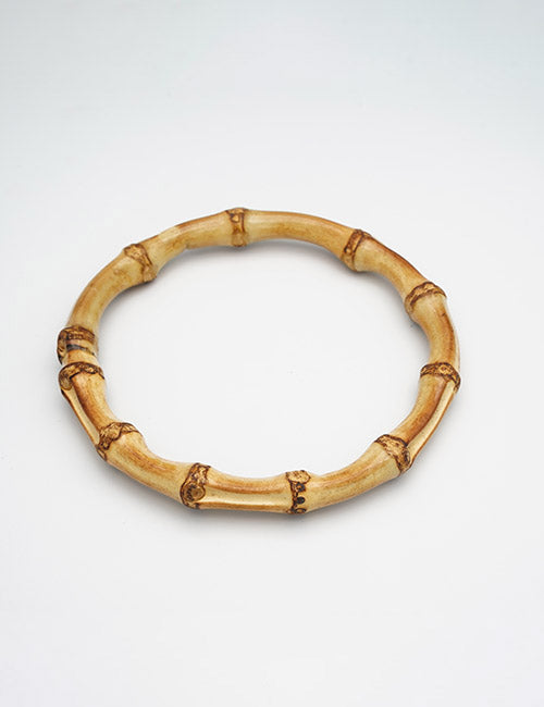 The YIPAI Handles are round, crafted from light brown bamboo segments with visible nodes and natural texture, forming a continuous loop. Displayed on a plain white background.