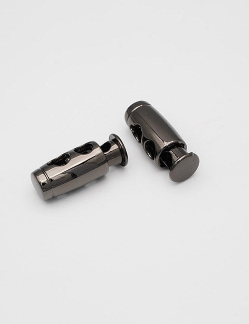Two YIPAI Handles cord locks, black and cylindrical with button releases, are on a plain white surface—one upright, the other on its side.