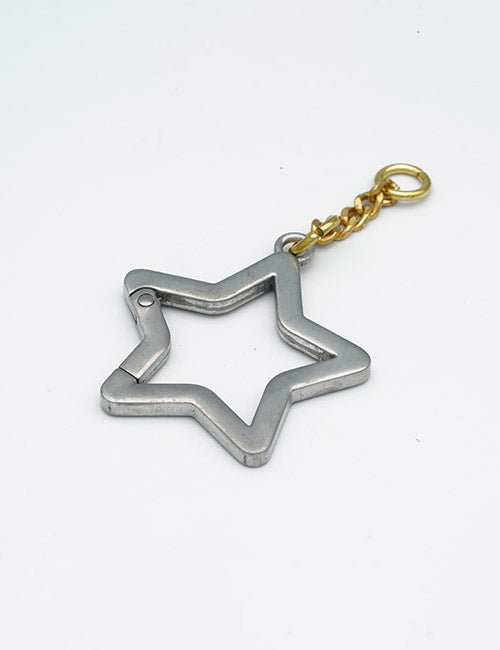The YIPAI Rings & Slides keychain features a metallic star shape with a small gold chain and ring attached to one point, displayed on a plain white background.