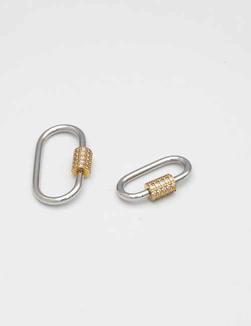 Two silver oval metal Rings & Slides from YIPAI, each with gold textured clasps, are displayed on a white background. One ring is larger than the other.