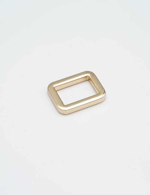 A small, gold rectangular metal ring with rounded edges from YIPAIs Rings & Slides collection is displayed on a plain white background.