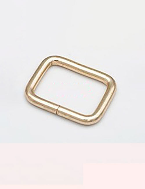 A small, gold-colored rectangular metal ring from YIPAIs Rings & Slides collection rests on a plain white background.