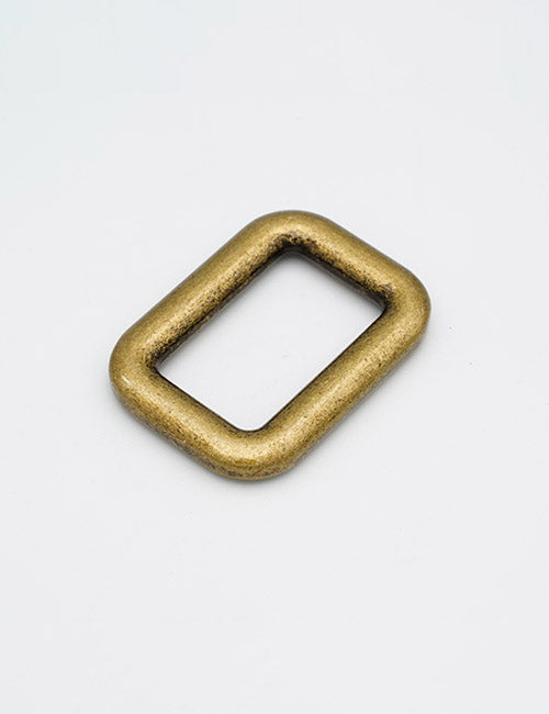 The YIPAI Rings & Slides is a small, rounded rectangular metal buckle with a brass finish, shown on a plain white background.
