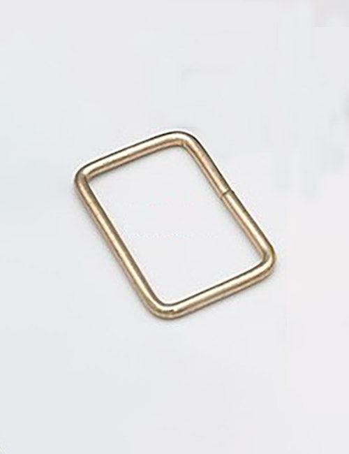 A YIPAI Rings & Slides small gold rectangular metal ring with rounded edges lies flat on a plain white background.