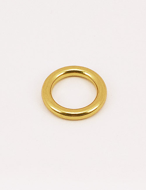 A YIPAI Rings & Slides gold metal ring with a smooth, shiny finish is centered on a plain white background.