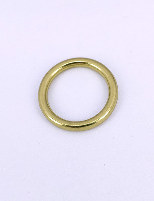A sleek, gold-colored metal ring from YIPAIs Rings & Slides collection is centered on a white background.