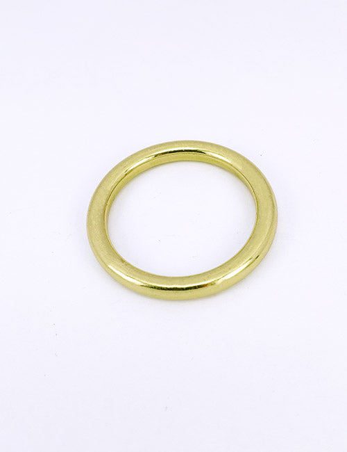 A smooth, gold-colored metal ring from YIPAIs Rings &Slides collection is displayed on a white background.
