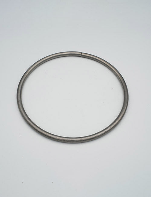 The YIPAI Rings & Slides is a simple, thin metallic band displayed on a plain, light gray background.